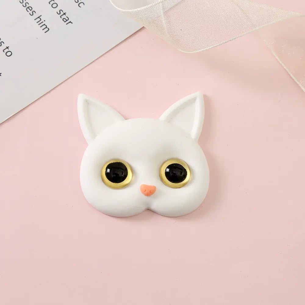 3D Cat Phone Holder Griptok - Mobile AccessoriesA handmade 3D cat-shaped phone holder grip designed for iPhone users. It offers: A secure, anti-drop grip for everyday use Stylish and charming design that adds personality to your device Versatility for scrolling, selfies, videos, and even home or car decor  Perfect for upgrading your phone accessories with both function and flair. Let me know if you&