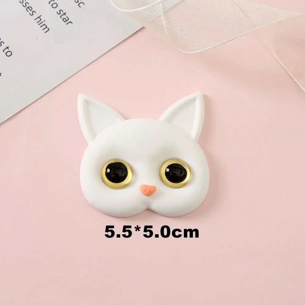3D Cat Phone Holder Griptok - Mobile AccessoriesA handmade 3D cat-shaped phone holder grip designed for iPhone users. It offers: A secure, anti-drop grip for everyday use Stylish and charming design that adds personality to your device Versatility for scrolling, selfies, videos, and even home or car decor  Perfect for upgrading your phone accessories with both function and flair. Let me know if you&