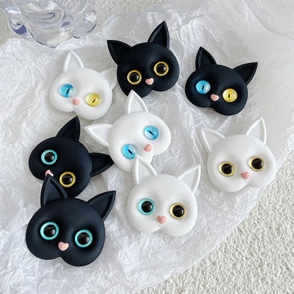 3D Cat Phone Holder Griptok - Mobile AccessoriesA handmade 3D cat-shaped phone holder grip designed for iPhone users. It offers: A secure, anti-drop grip for everyday use Stylish and charming design that adds personality to your device Versatility for scrolling, selfies, videos, and even home or car decor  Perfect for upgrading your phone accessories with both function and flair. Let me know if you&